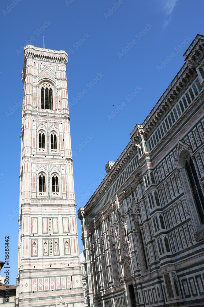 Giottos Campanile and Cathedral Santa Maria under blue sky in Florence, Tuscany Italy 