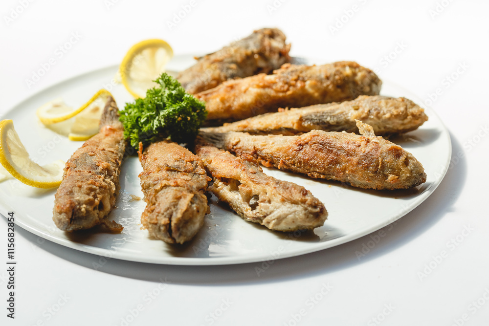 Fried fishes on white background for the menu Fried fishes on white background for the menu