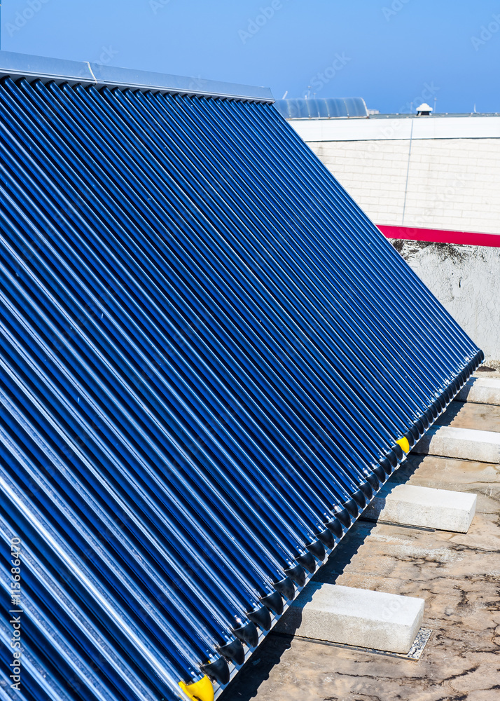 Vacuum solar cells for water heating system on the pool roof Stock ...