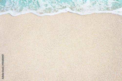 Soft ocean wave on the sandy beach, background.