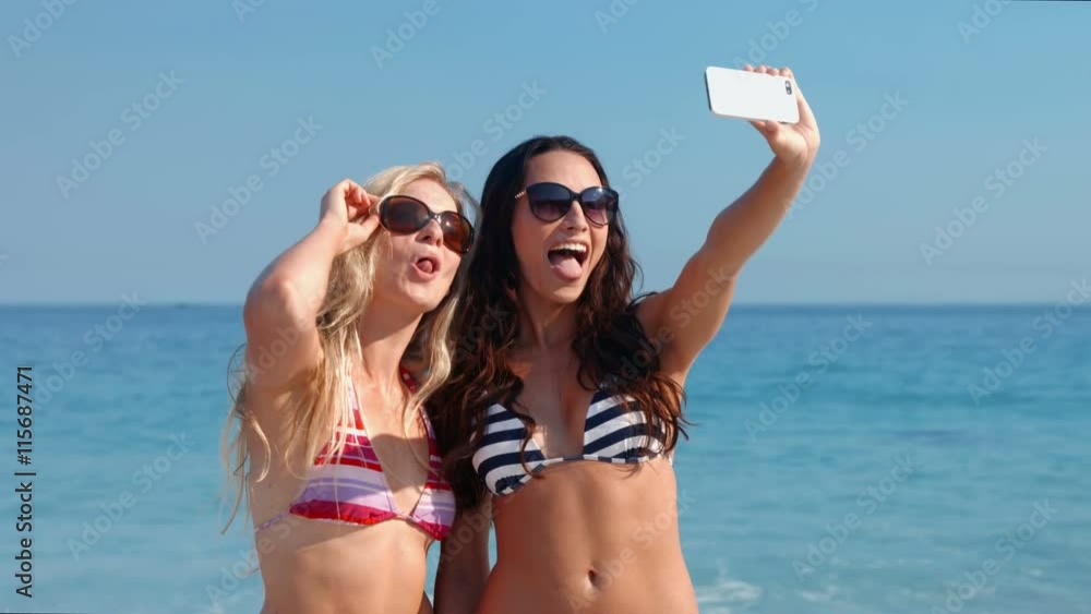 Video of happy pretty friends taking a selfie at the beach Video of happy pretty friends taking a selfie at the beach