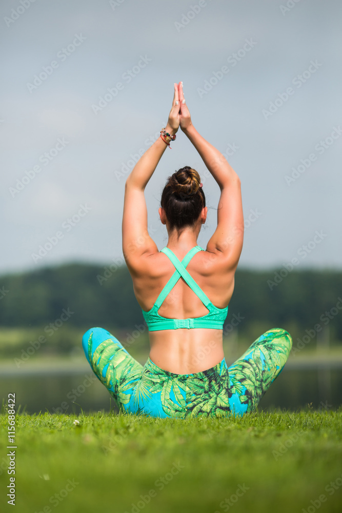 meditation. Yoga girl training outdoors on nature background. Yoga concept.