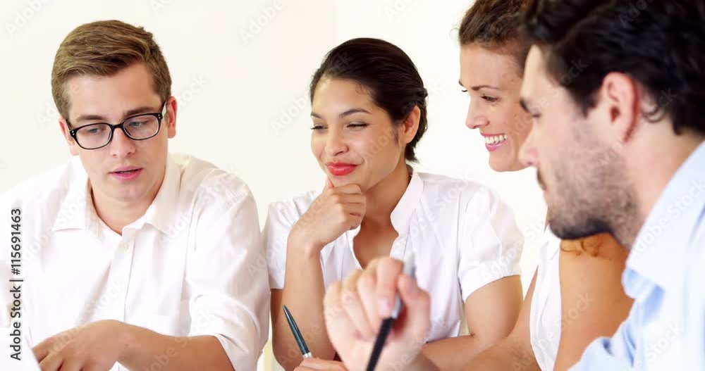 Business people having a meeting using the laptop Business people having a meeting using the laptop