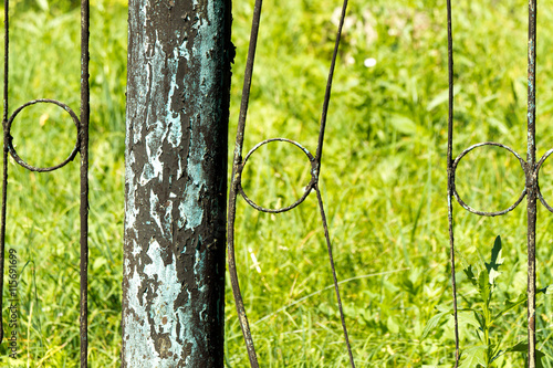 Canvas Print Fence made of rusty metal rods. Very old and rusty. The backgrou