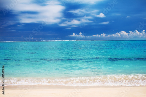 Beautiful landscape: turquoise ocean water and sandy beach, background