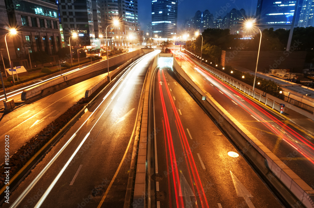 the light trails on the modern building background in shanghai china