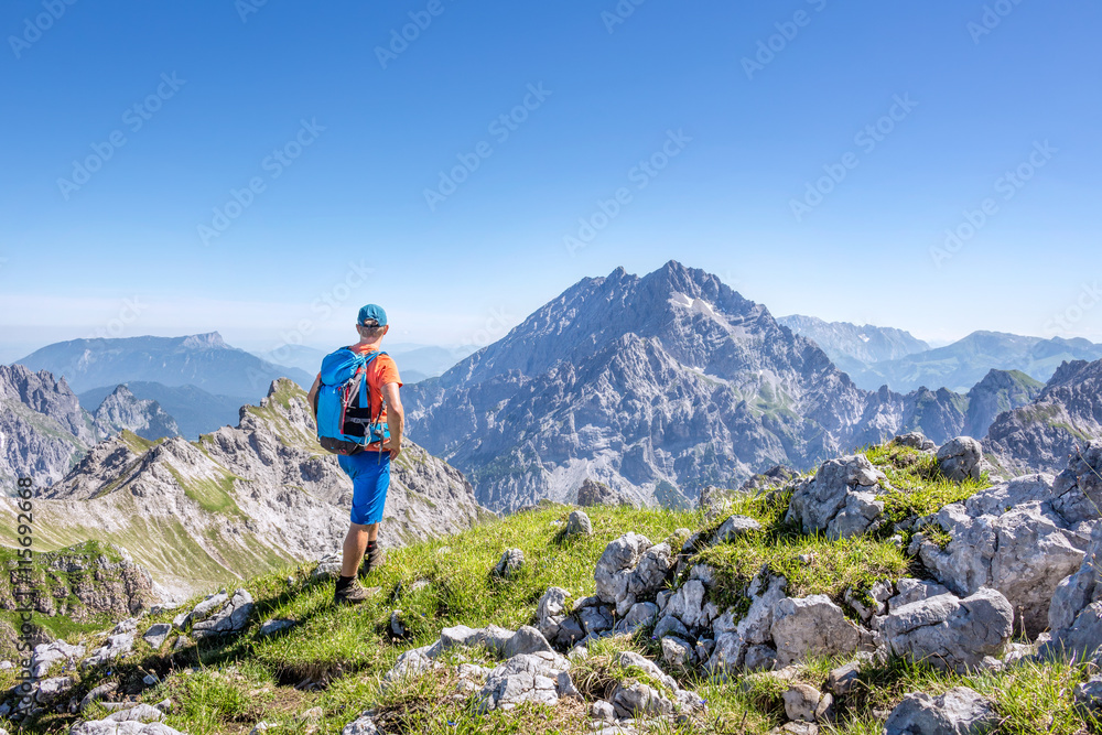 Mountaineer enjoying the view in the austrian alps