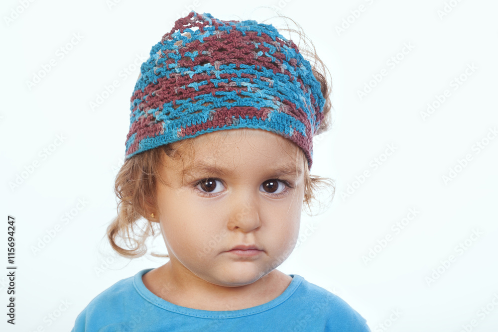 adorable calm girl looking at camera and wearing blue handmade h adorable calm girl looking at camera and wearing blue handmade h