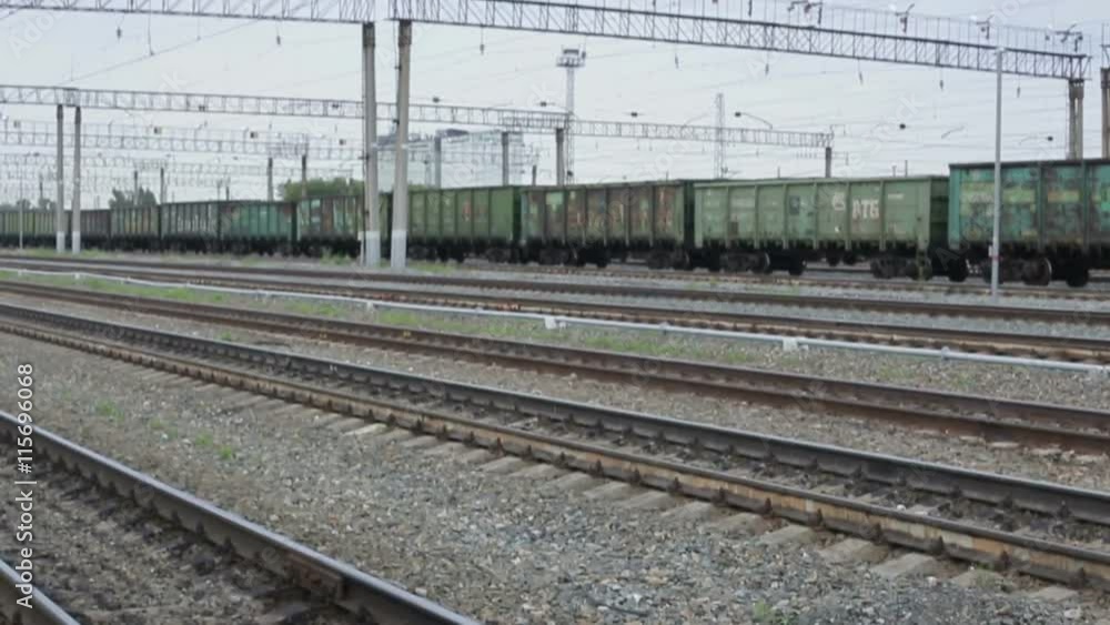 Cargo train traveling on railway tracks Cargo train traveling on railway tracks