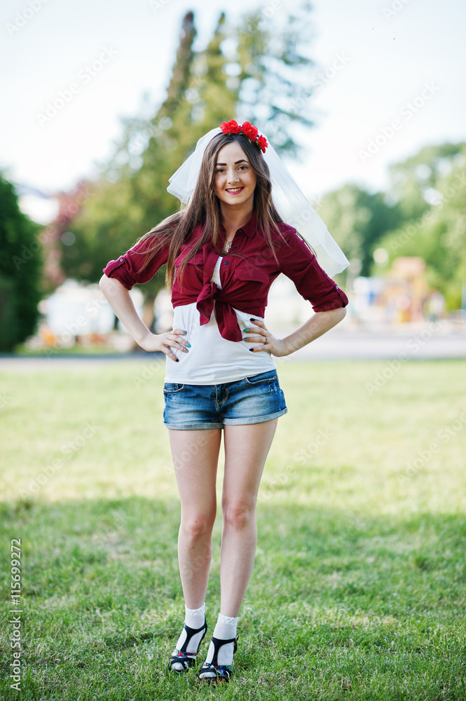 Portrait of style country girl on short jeans shorts and crossco Stock  Photo | Adobe Stock