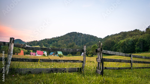 Wooden gate leading to field