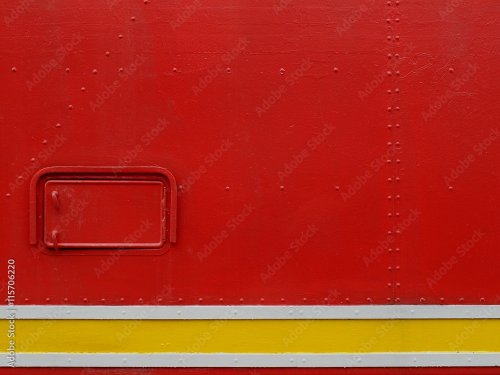 A red painted metal background. A red painted metal background.