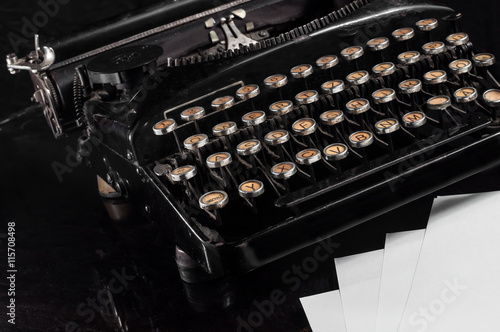 Retro Typewriter and blank sheets of paper