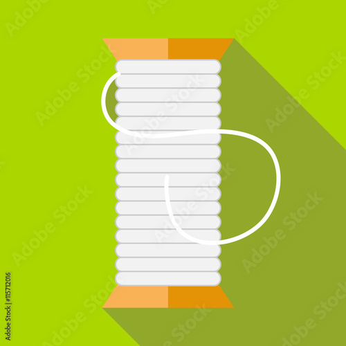 White thread spool icon in flat style on a green background