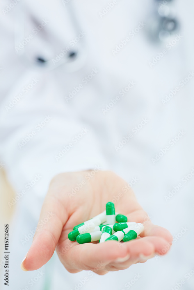 Female medicine doctor hands hold pills. Panacea and life save, prescribing treatment, legal drug store concept. Female medicine doctor hands hold pills. Panacea and life save, prescribing treatment, legal drug store concept.