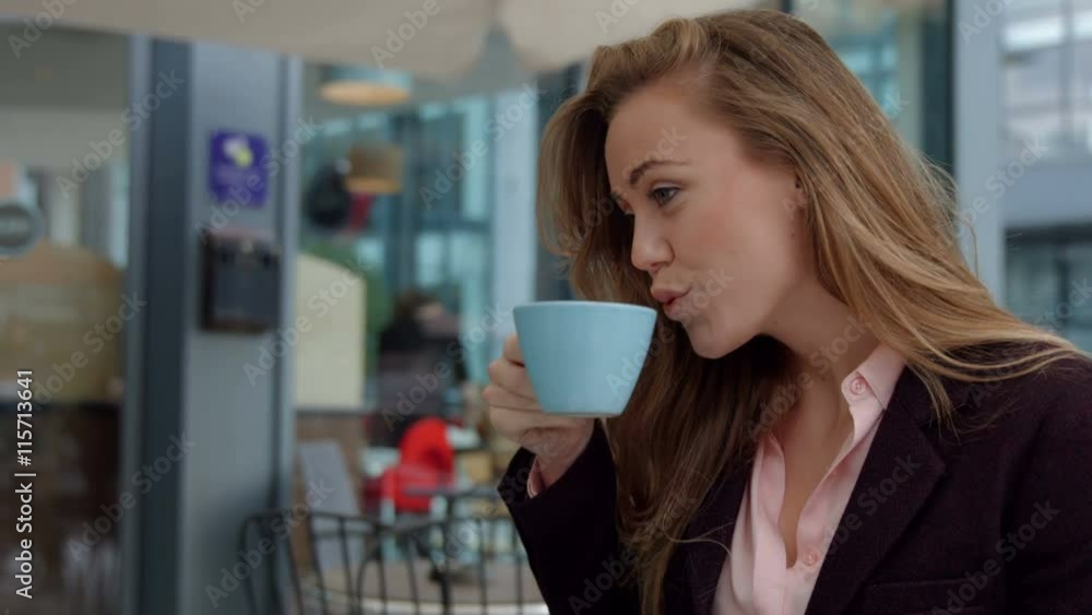 Businesswoman enjoying a coffee in cafe Businesswoman enjoying a coffee in cafe