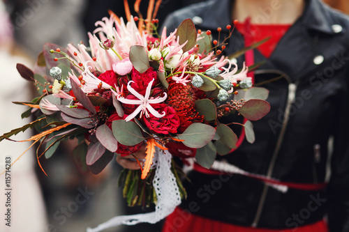 Wedding bouquet made of rannunculus, roses and chrysanthemums is photo