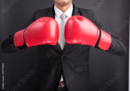 Young businessman with boxing gloves © sorapop