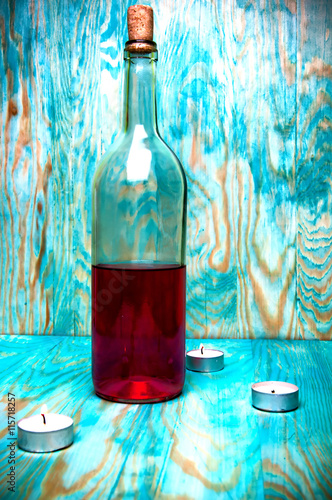 Rose wine closeup on blue wooden background photo