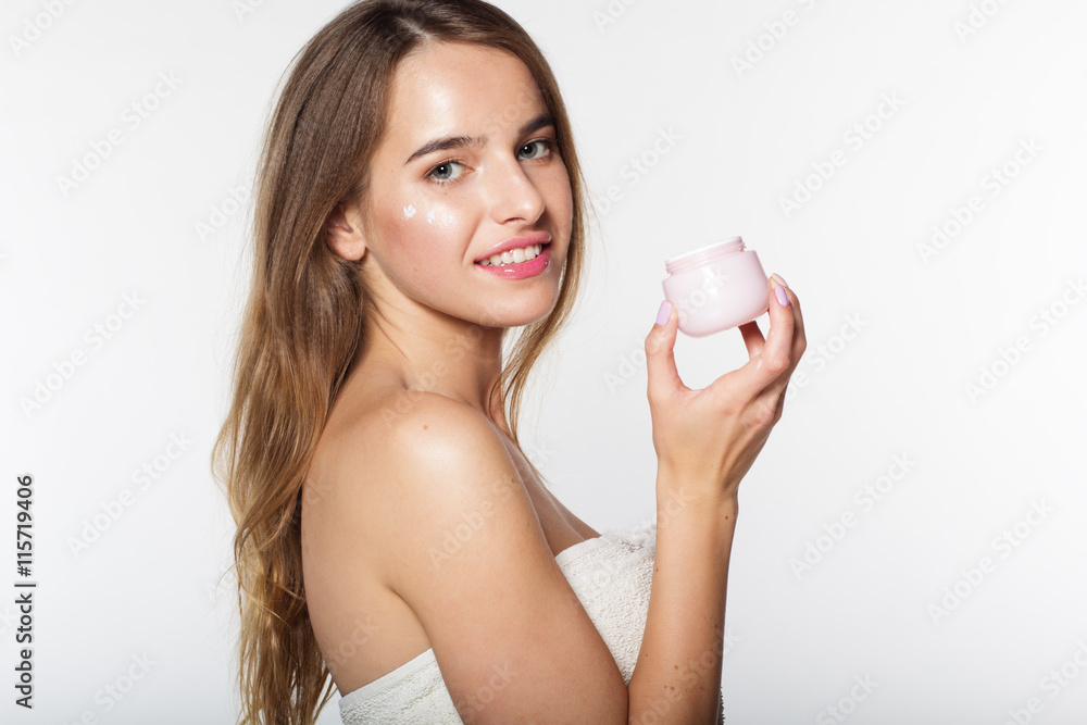 Girl with jar of moisturizing facial cream Girl with jar of moisturizing facial cream