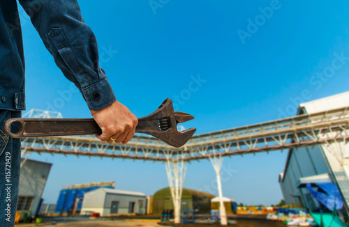 Mobile mechanic wrench industrial background. © patboon