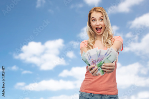 happy young woman with euro cash money