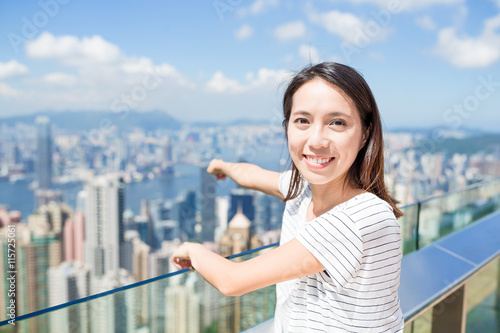 Free Download Woman finger pointing down to the city of Hong Kong - GFXLoad