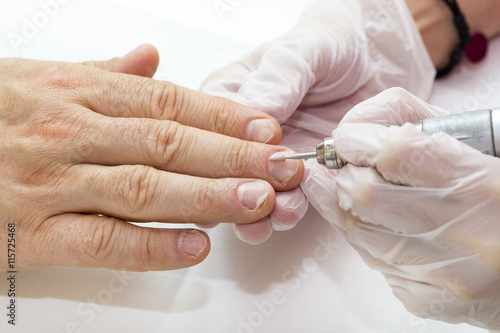 the process of the male manicure in a beauty salon