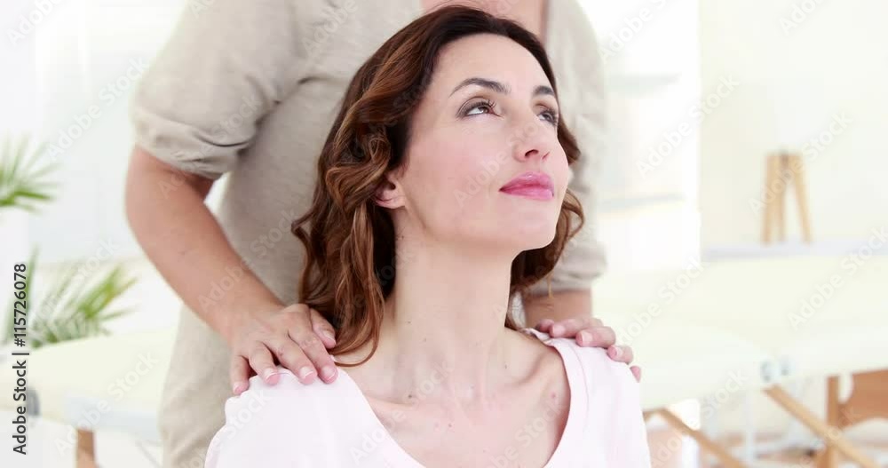 Woman getting reiki therapy Woman getting reiki therapy