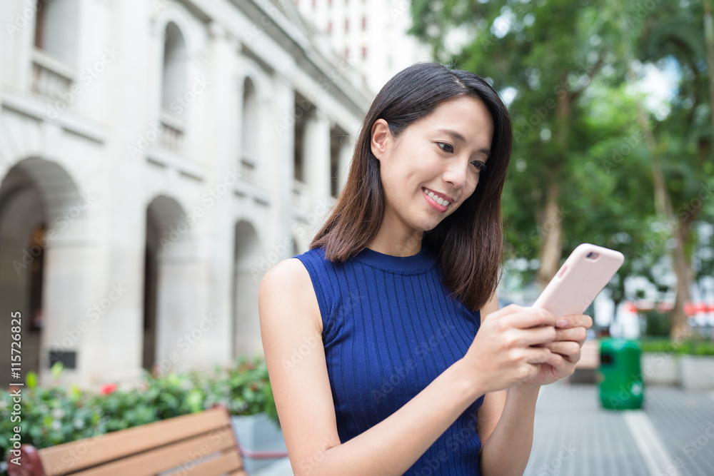 Woman using mobile phone at outdoor Woman using mobile phone at outdoor