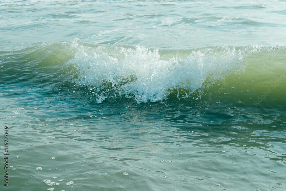 Ocean background: sea shore, turquoise waves, splashes, breaking wave, surf