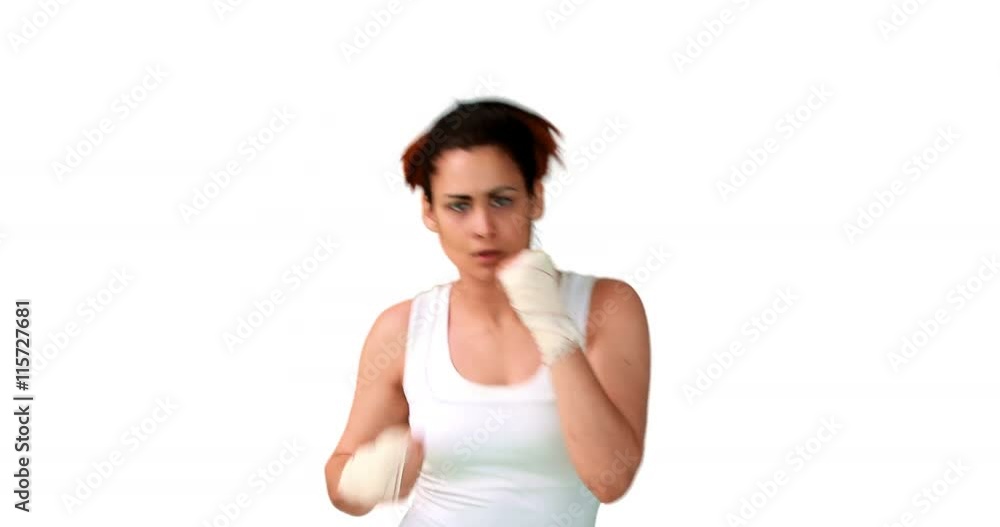 Fit brunette punching with bandaged fists Fit brunette punching with bandaged fists