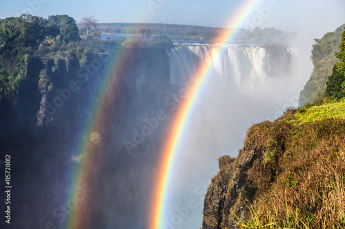 Fototapeta Victoria Falls. A general view with a rainbow. National park. Mosi-oa-Tunya National park. and World Heritage Site. Zambiya. Zimbabwe. An excellent illustration.