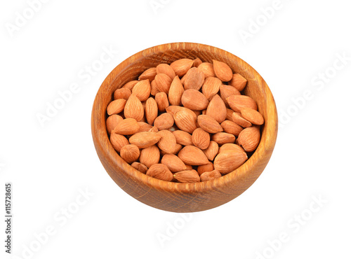 Dried apricot kernel in dish photo