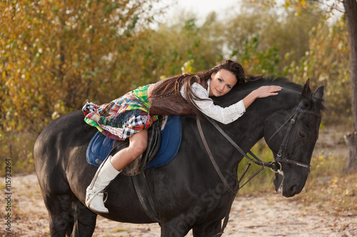Woman hugging her horse