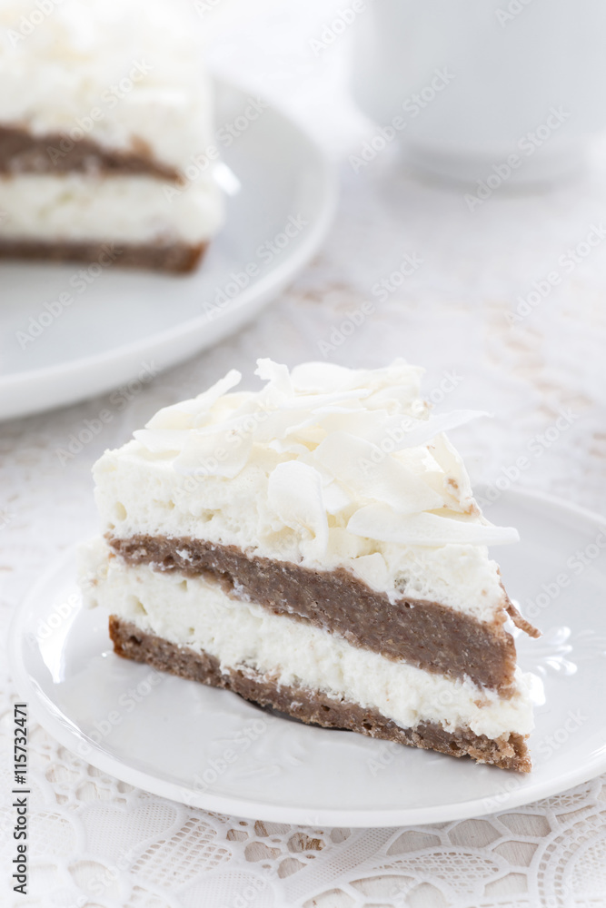 piece of delicious chocolate cake with coconut cream, vertical piece of delicious chocolate cake with coconut cream, vertical