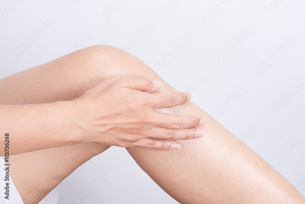 woman massaging her painful knee. woman massaging her painful knee.