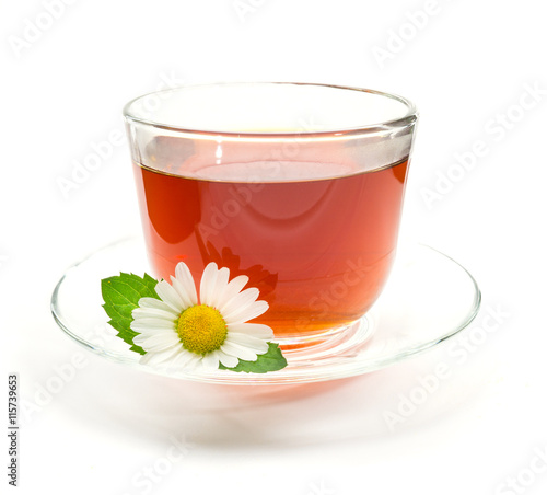 Cup of black tea with chamomile flower