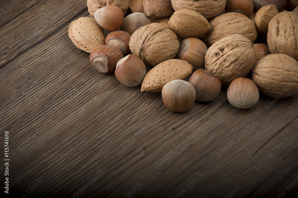 Fresh group of nuts on the wooden table Fresh group of nuts on the wooden table