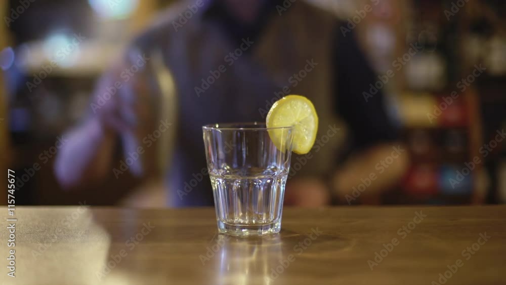 Bartender is making cocktail at bar counter Bartender is making cocktail at bar counter