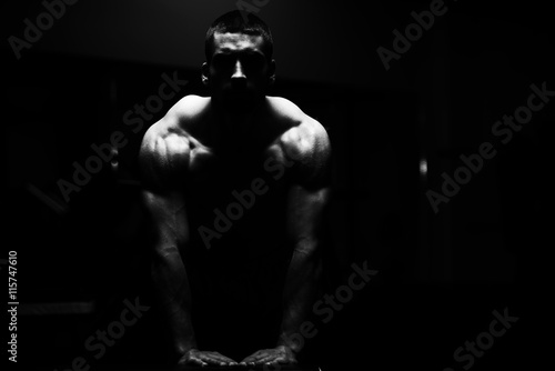 Pushups On Bench In A Dark Room