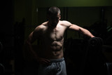 Shoulder Exercise With Dumbbell In Dark Room