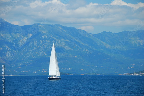 Lonely sailing vessel in the Boka Kotorska bay, Montenegro