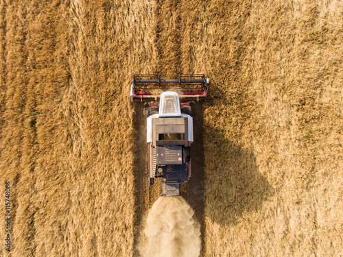 air shot of harvester on the wheat field