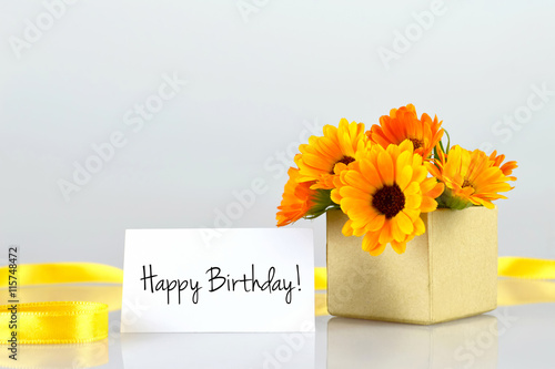 Canvas Print Happy Birthday card and marigold flowers arranged in gift box