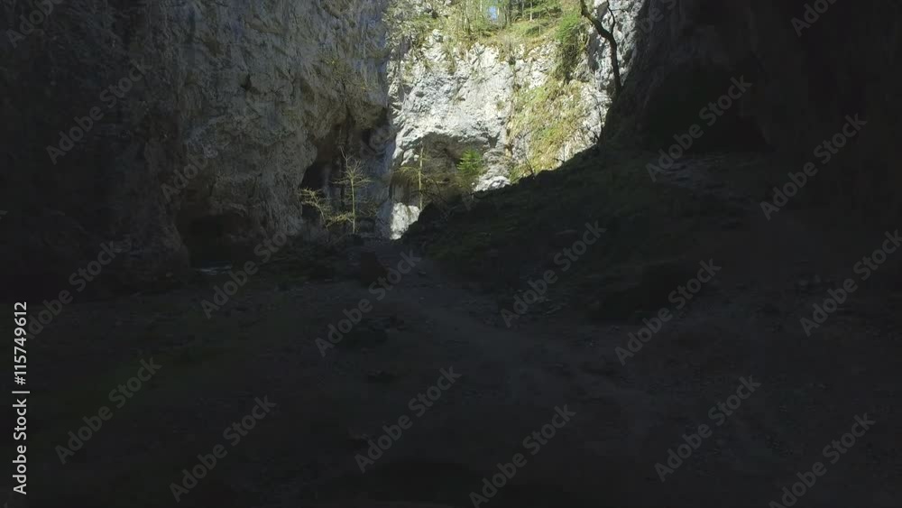 AERIAL: Amazing high rock walls and caves above the river AERIAL: Amazing high rock walls and caves above the river