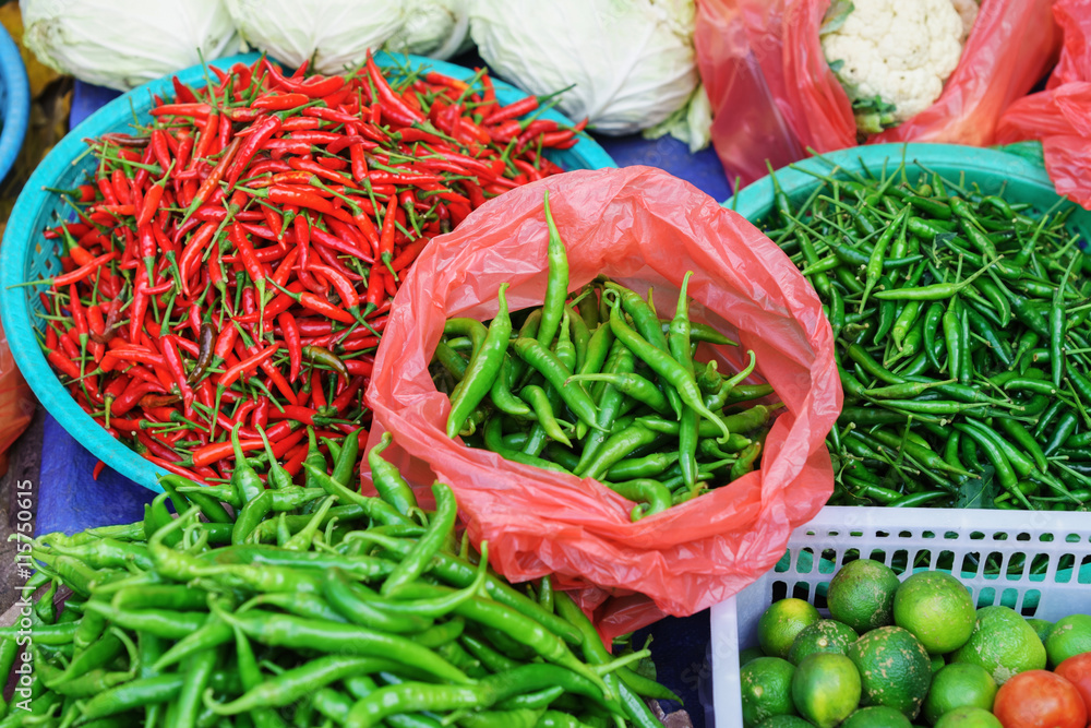 Asian street market selling Pod Pepper and lime in Vietnam
