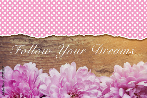 pink flowers on wooden with...