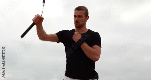 Fit man practicing martial arts photo