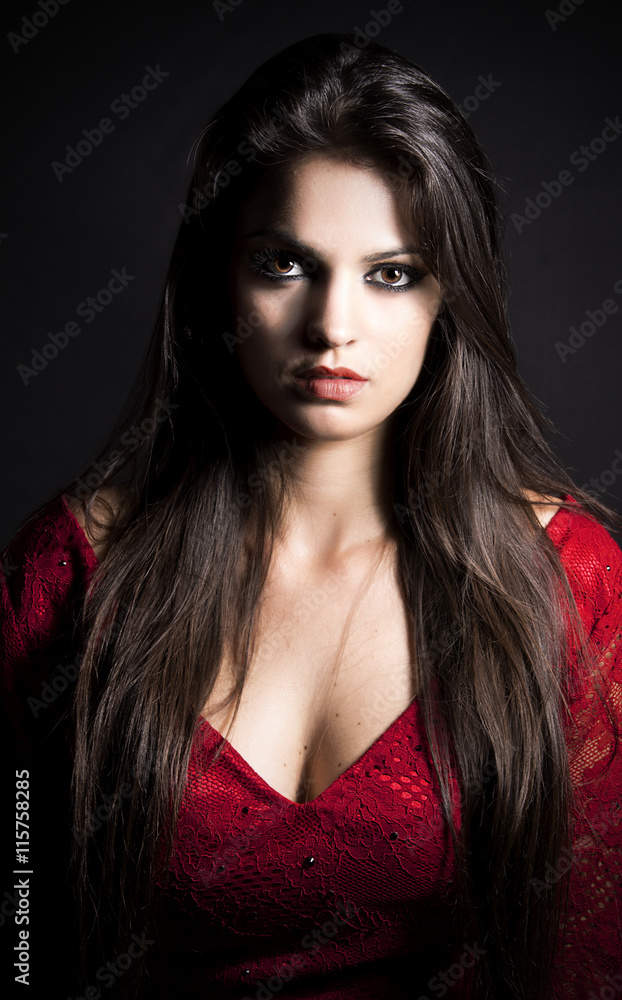 Beauty brunette girl with make-up.elegant lady in red dress Beauty brunette girl with make-up.elegant lady in red dress